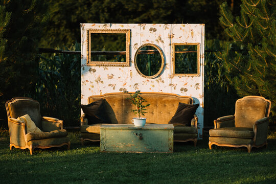 Vintage outdoor seating arrangement with green table.
