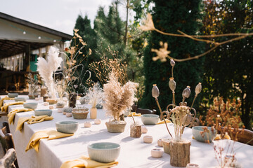 Beautifully decorated outdoor table with natural elements