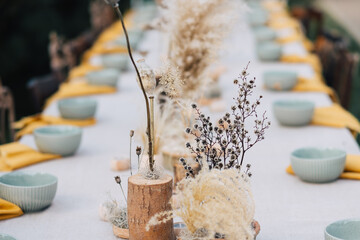 Elegant table set for dining with a natural theme.