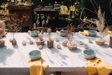 Outdoor dining table set with natural decorations