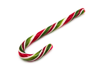 Fototapeta premium Classic glossy christmas candy cane lollipop isolated on white background. Kids festive sweets and treats. Symbol of gifts for the winter holidays. 