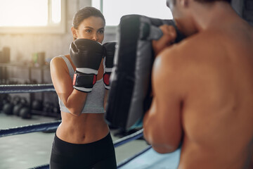 An intense and focused training session with a dedicated boxer meticulously practicing techniques...