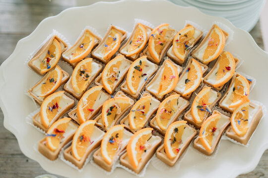Orange tarts elegantly arranged on a dessert plate.