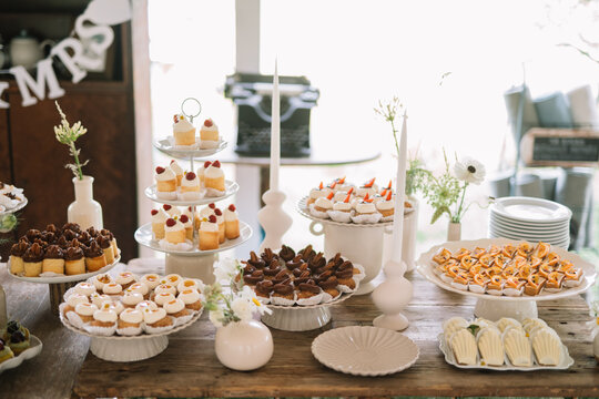 Assorted desserts on a table with elegant decorations.