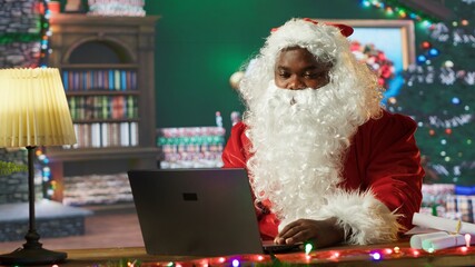 Saint Nicholas talking to parents and kids before Christmas eve, using web video call to find out...