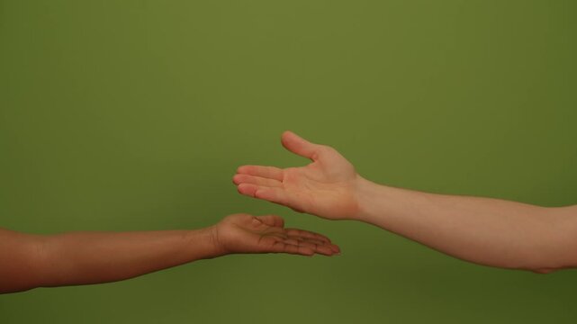 An Outstretched Hand Set Against a Vibrant Green Background Creates a Visually Impactful Scene