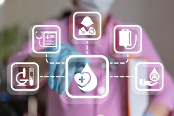 Doctor working on virtual touch screen with icons symbolizing concept: BLOOD DONATION. Donate blood...