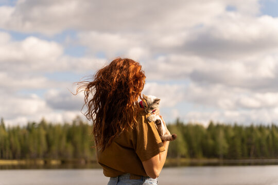 Woman with Cat by Lake