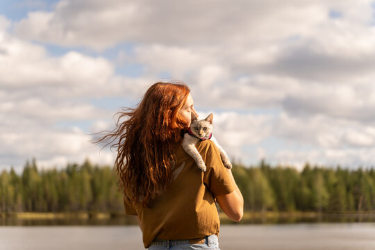 Woman with Cat by Lake