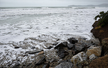 Waves crashing over rocks ocean rough east coast new zealand oamaru