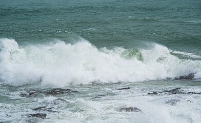 Waves crashing over rocks ocean rough east coast new zealand oamaru