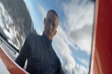 Reflective moment of a young man in winter