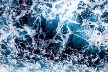 Water surface texture. Aerial view of breathtaking water with foam. Can be used in covers, packaging, posters, textures, wallpapers, art and design projects. Stunning nature background image.