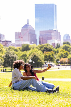 Teen Black Friends portrait selfie in City of Boston Common skyline 