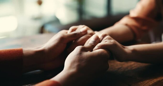 Love, empathy and support with couple and holding hands for care, trust and sympathy. Comfort, partner and gratitude with closeup of people at home for helping, solidarity and kindness together