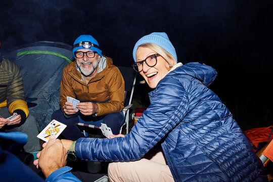 Friends enjoying card games at the camp