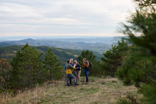 Friends enjoying a moment of rest during their hike