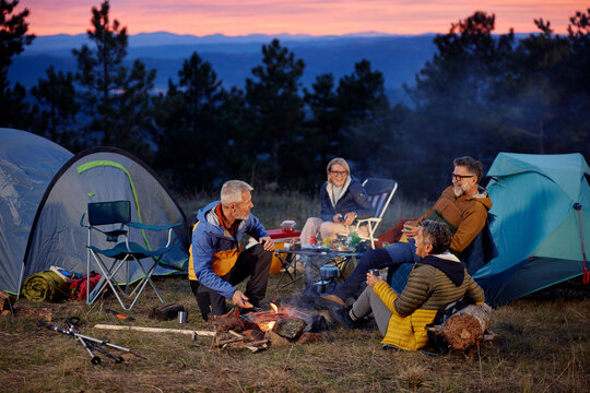 Friends enjoying a camping experience in the mountains