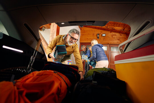 Friends prepare their stuff for a roadtrip