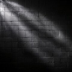 Sunlight or a lamp refracts and reflects onto a black wall with a texture that creates shadows dark background