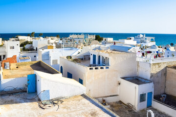 View of the roofs of white houses in the medieval medina of Hammamet, Tunisia.