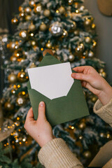 Girl holding letter with space for text, Christmas mood