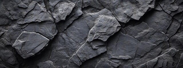 Dark Rugged Rock Surface Close-up with Jagged Edges and Deep Crevices Dramatic Grunge Background