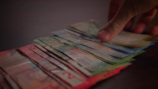 Close up dolly shot showing many different swiss franc banknotes - Cash Money Counting. Swiss Francs Banknotes