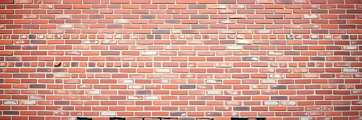 Obraz premium expansive view of empty old red brick wall, ideal for showcasing promotional text or marketing content. This textured surface offers ample copy space for creative designs