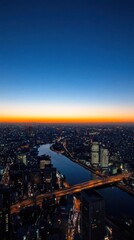 Fototapeta premium A stunning cityscape at dusk, showcasing a river and illuminated skyline.