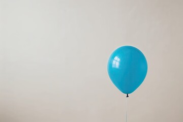 Obraz premium Single Blue Balloon Floating Against a Clean Background