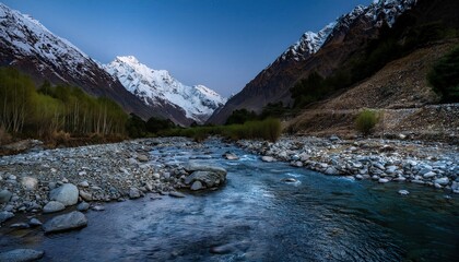 Twilight stream winds through rocky silence, cold water threading between midnight shadows, echoing mountain's deep, unspoken stories.
