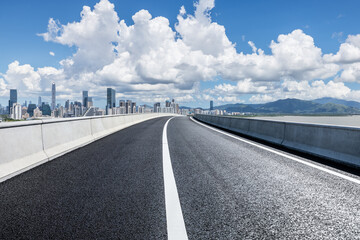 Asphalt highway road with modern city buildings scenery in Shenzhen. road trip.
