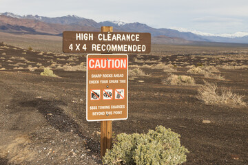 Caution sign in the desert at Death Valley National Park, California