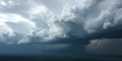 Obraz premium Towering dark storm cloud dominates the entire landscape , heavy clouds, towering darkness, stormy weather