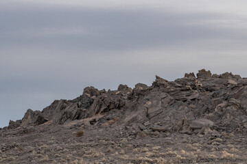 Obsidian Butte on the south shore of the Salton Sea. Calipatria, Imperial County, California. The Salton Buttes lie within the Salton Sea Geothermal Field. Rhyolite. dry lake bed.