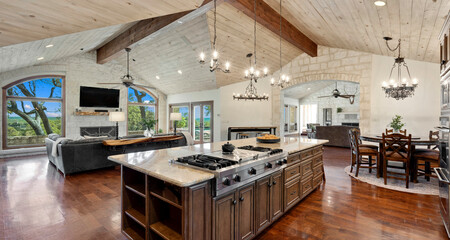 Elegant open kitchen and dining area in a modern home with scenic views
