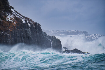 wave crashing on rocks