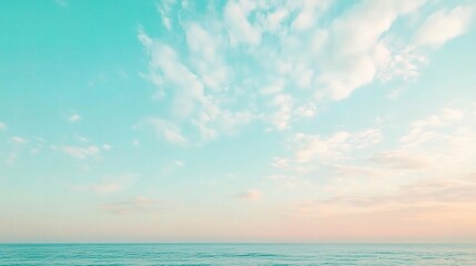 Fototapeta premium Serene Sky Gradient with Soft Clouds and Calm Ocean Background