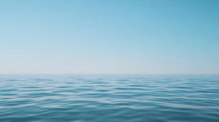 Obraz premium Calm ocean waves under clear blue sky.