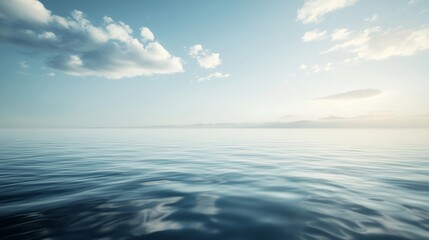Obraz premium Calm ocean with serene blue sky and clouds.