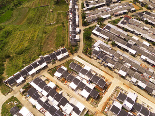 Real Estate development on the edge of Bandung City from an Aerial perspective. New housing...