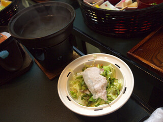 Japanese nabe fish soup Ingredients and bowl on fire ready for cooking
