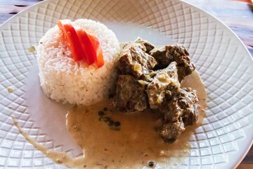 Savory Beef Stew with Creamy Sauce and Rice