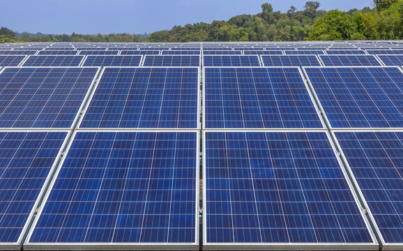 Close up rows array of Solar panels or solar cells or photovoltaics in solar power station alternative clean renewable energy efficiency sustainable