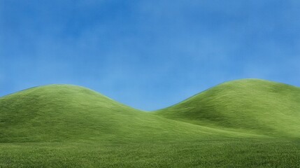 Fototapeta premium Lush green hills under a clear blue sky.