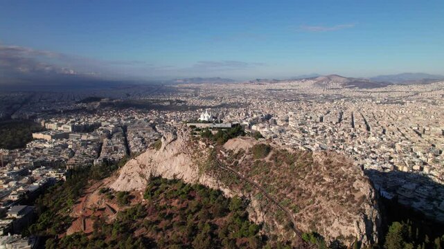 Holy Church of Saint George of Lycabettus, aerial shot with Athens Greece skyline panorama, 4K