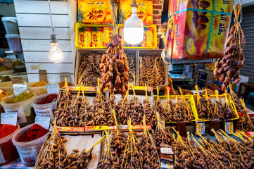Traditional Arabic stands with dates at the street market in medina of Sousse, Tunisia.