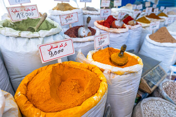 Traditional Arabic stand with spices at the street market in medina.