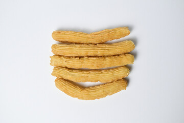 Stacked Churros, isolated on the white background, food blog, top view.